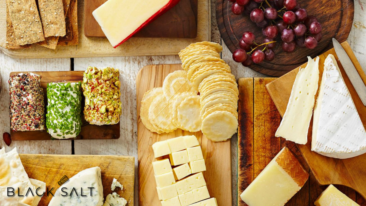 Cheese & Cracker Platter, featuring a delectable selection of assorted cheeses paired with a variety of crispy crackers, offering a delightful combination of flavors and textures for your enjoyment.