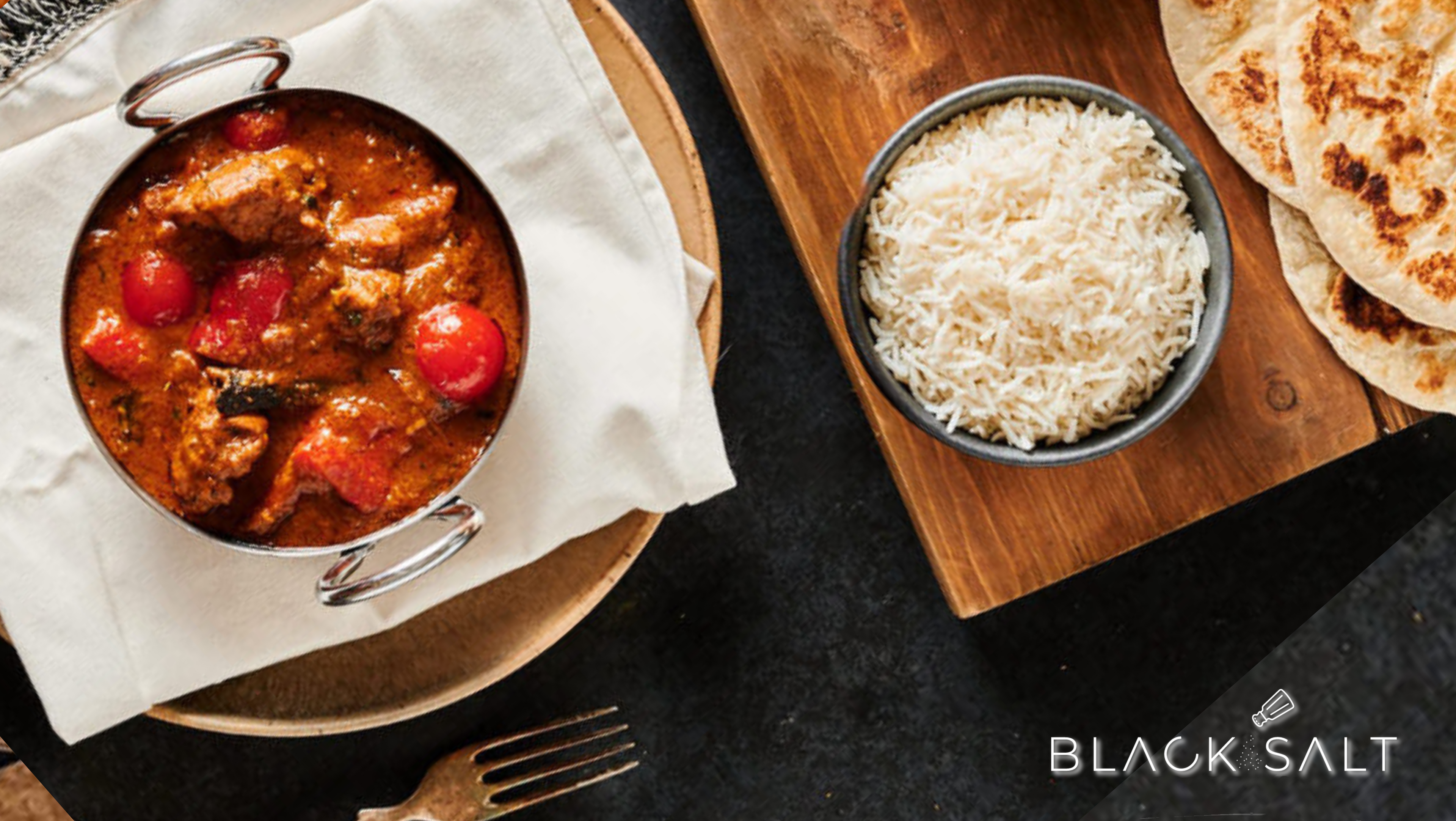 Mutton Rogan Josh Meal, a traditional Indian dish made with tender mutton (goat meat) cooked in a rich and aromatic tomato-based curry sauce, offering a flavorful and satisfying meal option.