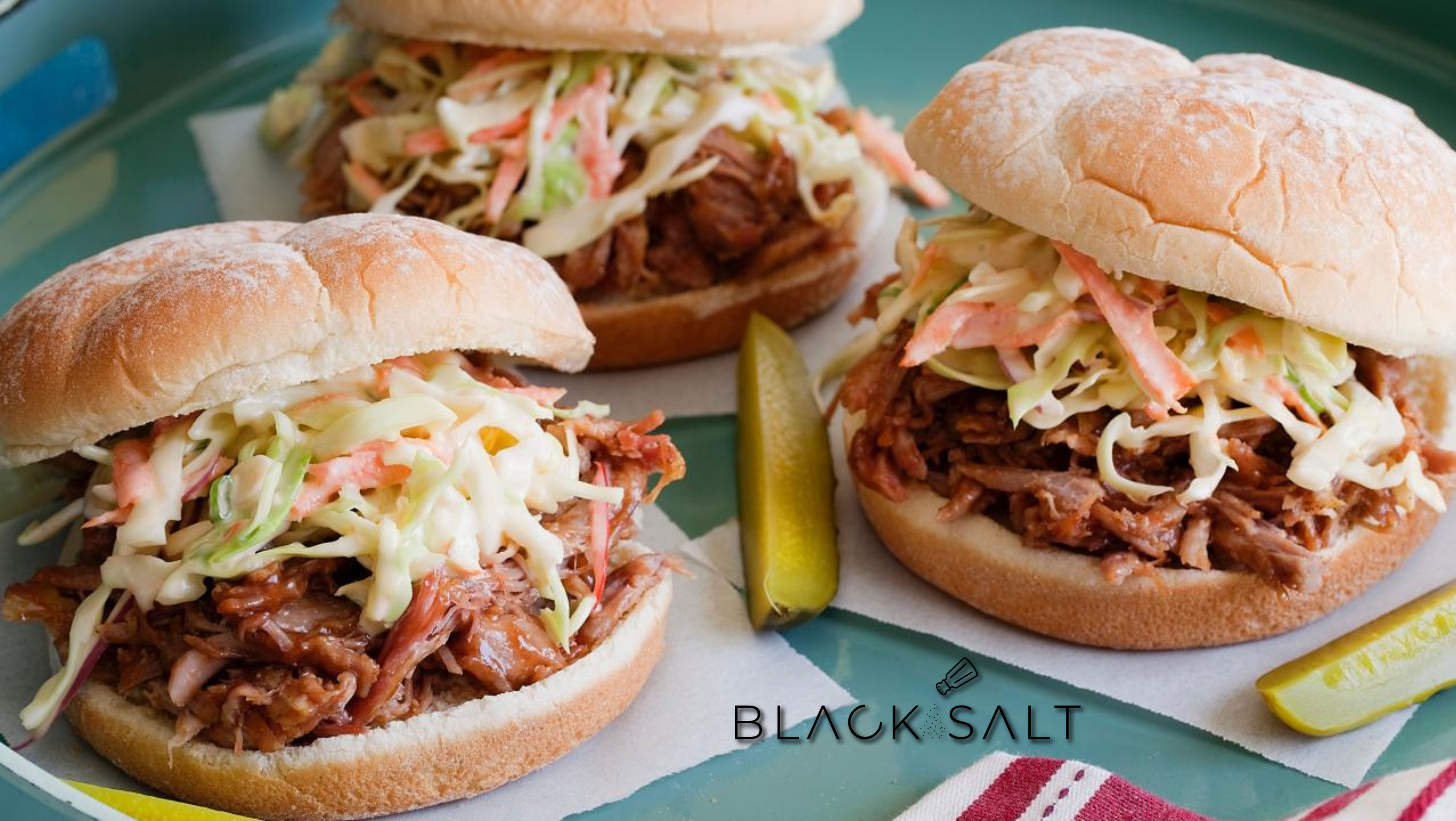 Pulled Pork Sliders, tender and juicy pulled pork piled onto soft slider buns, topped with a tangy barbecue sauce and served with coleslaw, offering a flavorful and satisfying handheld option for parties or casual gatherings.