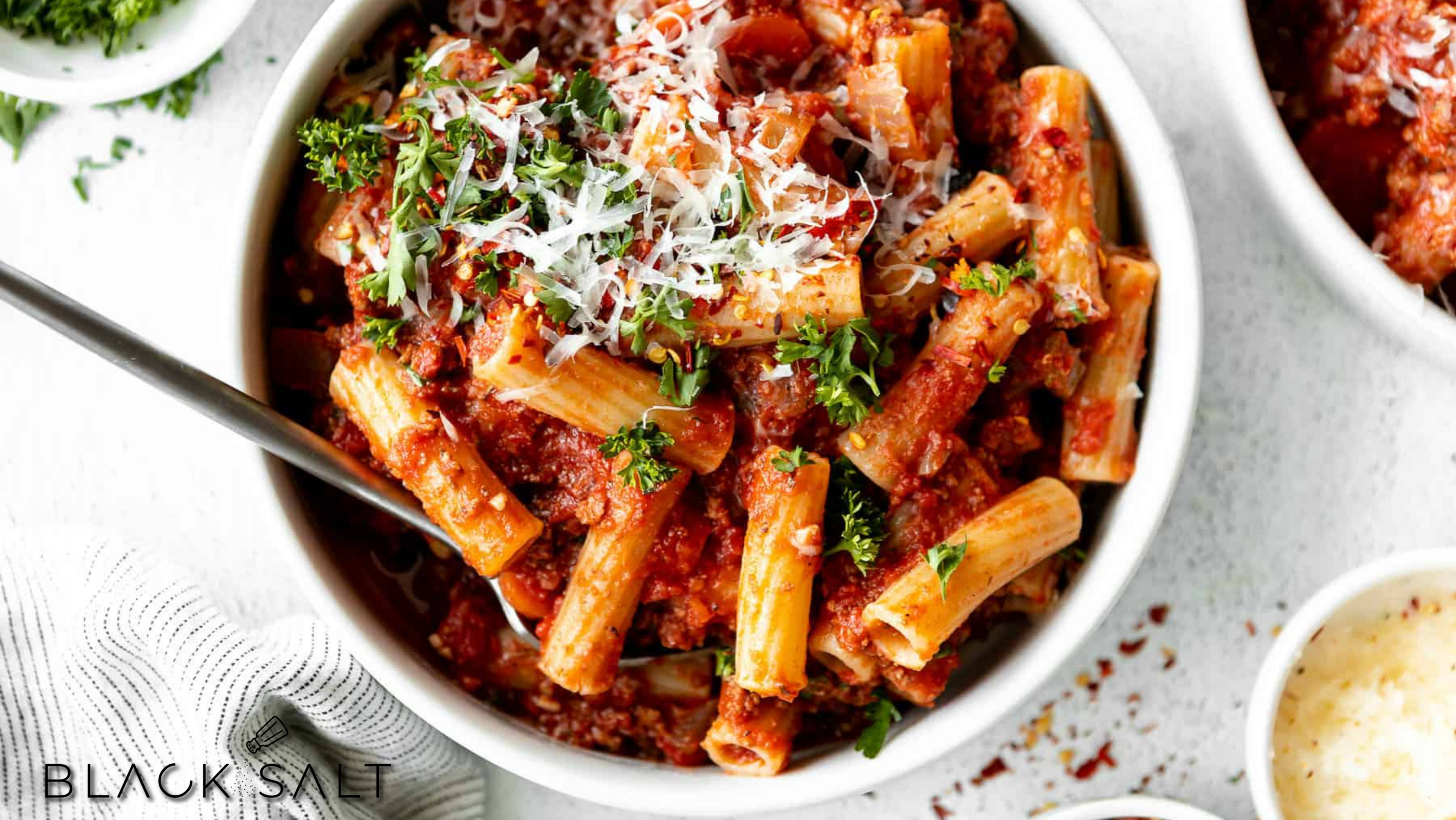 Rigatoni, large tube-shaped pasta with ridges, offering a versatile and satisfying option for pasta dishes, often paired with robust sauces or used in baked pasta recipes.