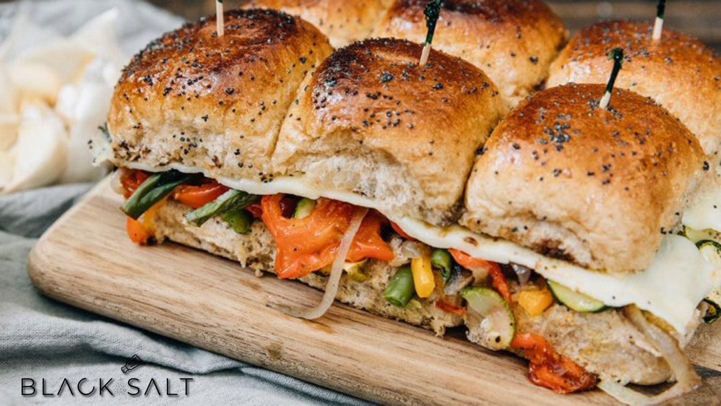 Roasted Vegetable Sliders, mini sandwiches filled with a medley of roasted vegetables such as bell peppers, zucchini, eggplant, and onions, offering a flavorful and satisfying vegetarian option for sliders.