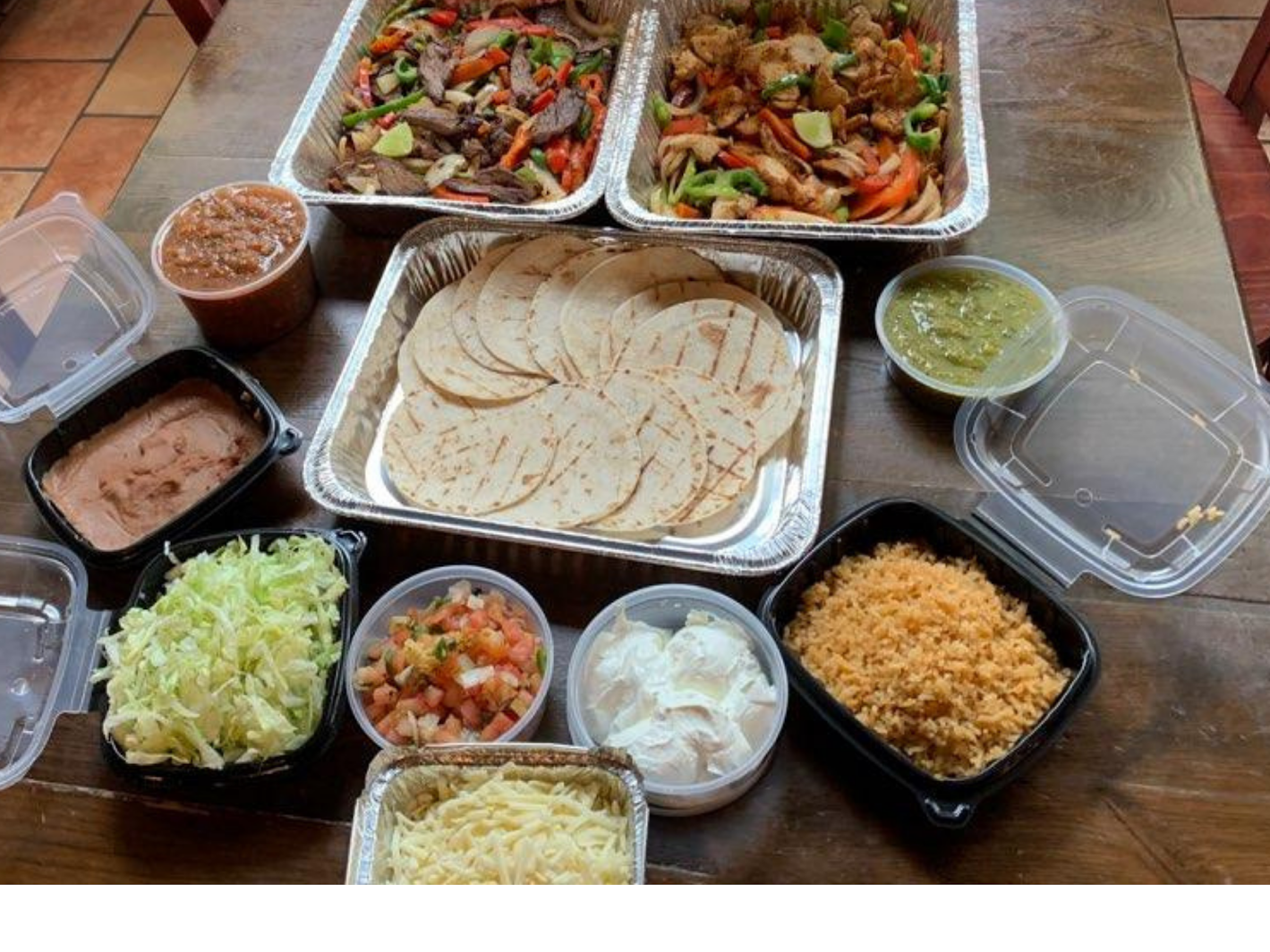 Grilled chicken & beef strips, sautéed peppers & onions, black beans, Mexican rice, shredded cheese, chopped onions, cilantro, pickling jalapeños, lettuce, pico de gallo, sour cream, guacamole. Soft Tortillas. Corn Tortillas (Gluten-Free) available upon request