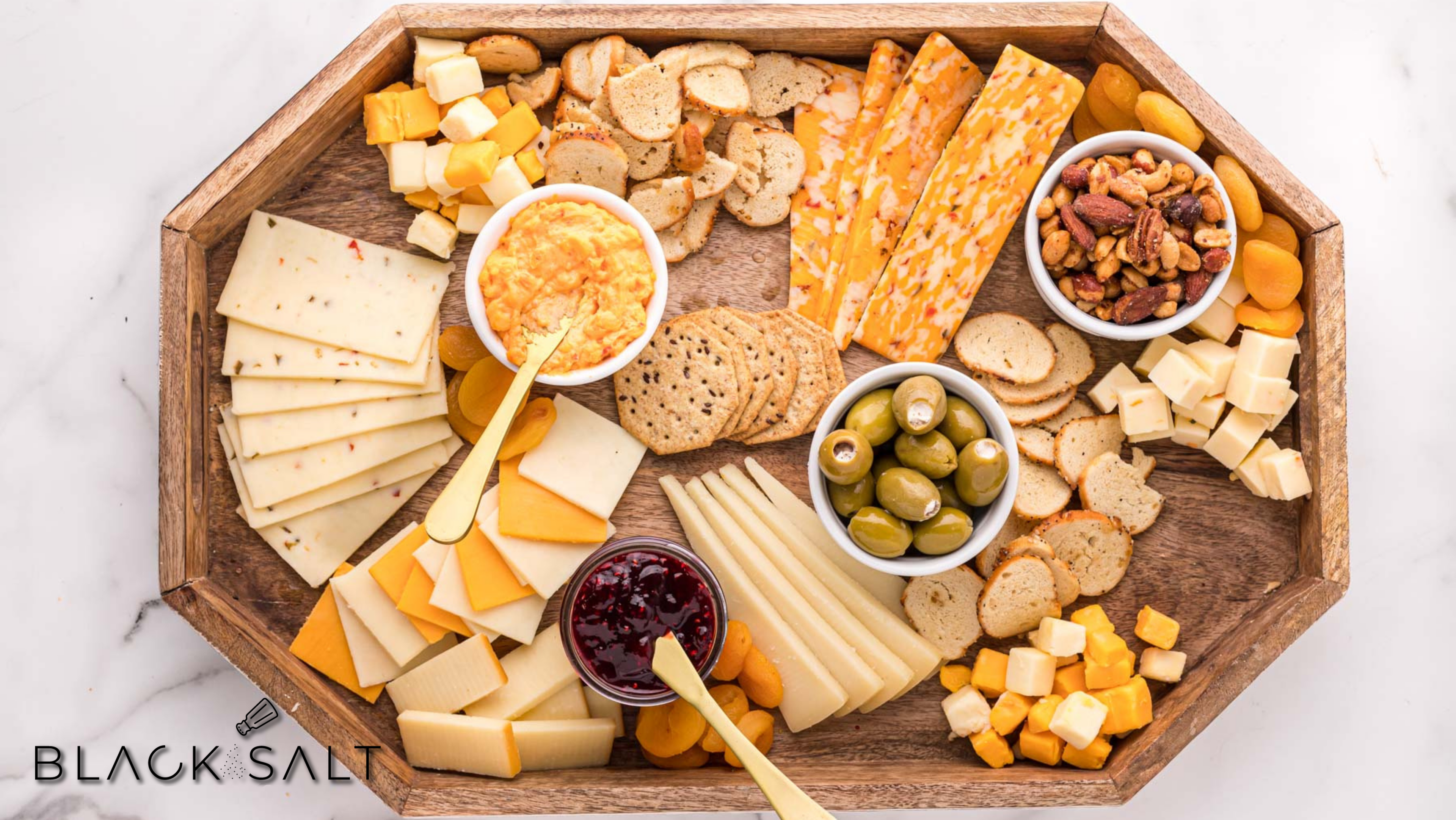 An exquisite arrangement of artisan cheese and assorted crackers, creating a delightful combination of flavors and textures.
