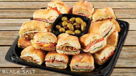 A delectable assortment of sandwiches with various fillings, beautifully arranged on a platter, offering a range of flavors and options for every palate.