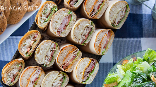 A tempting selection of assorted sandwiches with a variety of fillings, providing a delightful and convenient meal option for any occasion.
