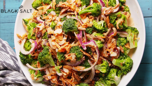 A tantalizing Bacon & Broccoli Salad, featuring crispy bacon, fresh broccoli florets, and a flavorful dressing, creating a delightful combination of textures and flavors.