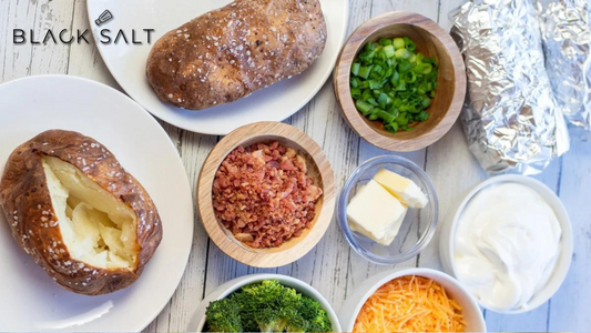 Make Your Own Baked Potato Bar, a customizable spread featuring fluffy baked potatoes served with a variety of toppings such as sour cream, cheese, bacon, chives, and other condiments, allowing guests to create their own delicious loaded potatoes.