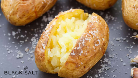 Perfectly baked potatoes, with a crispy skin and fluffy interior, ready to be topped with an array of delicious toppings for a hearty and comforting meal.