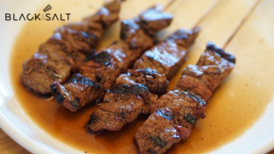 Flavorful Banyan Beef Skewers, featuring tender and marinated beef chunks, skewered and grilled to perfection, offering a delicious and savory option for your event or gathering.
