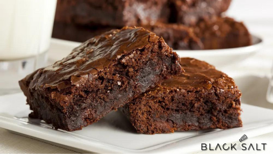 Irresistible brownies, moist and fudgy, with a rich chocolate flavor, perfect for indulging in a sweet treat.