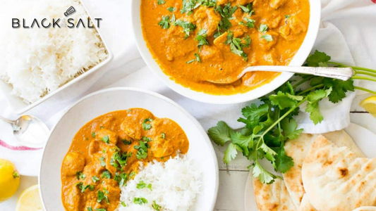 Butter Chicken Meal, a classic and flavorful dish with tender chicken cooked in a creamy and spiced tomato-based sauce, served with aromatic basmati rice and naan bread, creating a satisfying and delicious Indian cuisine experience.