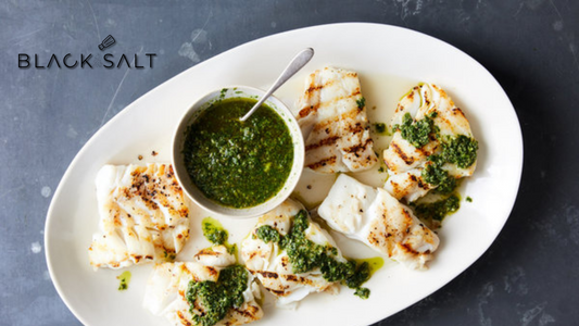 Cod Fish, a mild and flaky white fish known for its delicate flavor, often prepared grilled, baked, or pan-fried, providing a versatile and delicious seafood option.