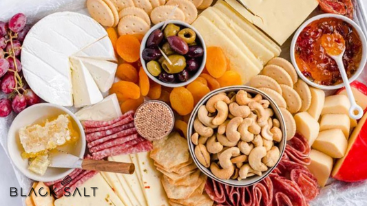 A stunning Charcuterie Platter, showcasing a delightful assortment of cured meats, artisanal cheeses, olives, pickles, and crackers, offering a visually appealing and delicious option for a variety of occasions.