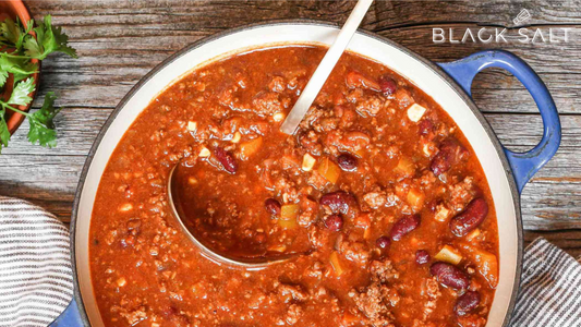 Hearty and flavorful Chili, made with a combination of ground beef, beans, tomatoes, and spices, offering a comforting and satisfying option for cooler days or casual gatherings.