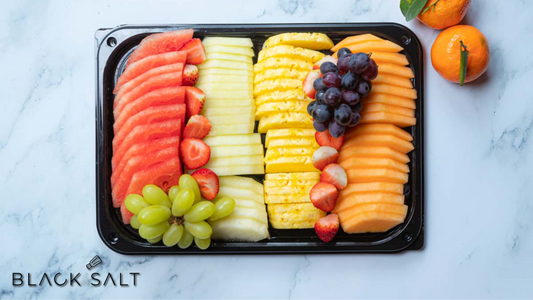 Fresh Fruit Platter, a vibrant assortment of ripe and juicy fruits, including berries, melons, grapes, and citrus, arranged beautifully for a refreshing and colorful display.
