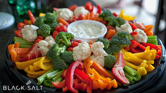Fresh Vegetable Platter, a colorful assortment of crisp and crunchy vegetables, such as carrot sticks, cucumber slices, bell pepper strips, and cherry tomatoes, offering a refreshing and nutritious option for snacking or as a vibrant addition to any gathering or event.