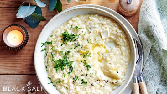 Gourmet Risotto, a creamy and flavorful Italian dish made with Arborio rice cooked to a perfect al dente consistency and combined with various ingredients such as mushrooms, vegetables, or seafood, offering a rich and satisfying meal option.