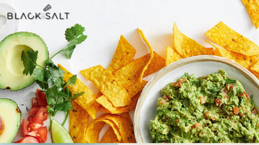 Guacamole & Chips, a vibrant bowl of freshly made guacamole, creamy and flavorful, served with a side of crispy tortilla chips, creating a delicious and popular appetizer or snack option.