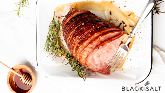 Honey Cured Ham, a succulent and flavorful ham coated with a sweet and tangy honey glaze, offering a delicious centerpiece for holiday meals or special occasions.