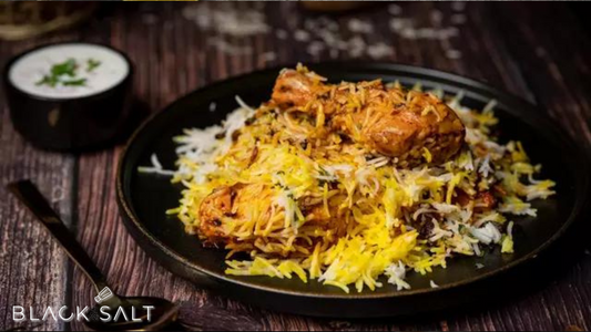 Hyderabadi Chicken Biryani, a fragrant and flavorful Indian rice dish made with basmati rice, tender chicken, and a blend of aromatic spices, offering a delightful and satisfying meal option.