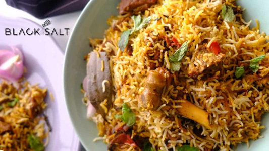 Hyderabadi Mutton Biryani, a fragrant and flavorful Indian rice dish made with basmati rice, tender mutton (goat meat), and a blend of aromatic spices, offering a delightful and satisfying meal option.