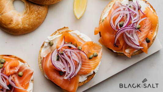 Lox & Bagel Platter, a delightful arrangement of fresh bagels, thinly sliced lox (smoked salmon), cream cheese, red onions, capers, and other garnishes, creating a classic and delicious combination for a satisfying breakfast or brunch.