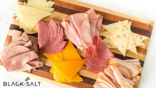 Meats and Cheese Platter, a delightful assortment of cured meats and artisanal cheeses, presented together on a platter, offering a variety of flavors, textures, and options for creating delicious combinations.