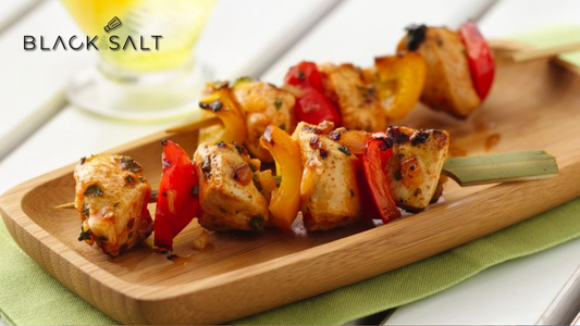 Mini Chicken Skewers, succulent and tender pieces of chicken threaded onto small skewers, grilled or baked to perfection, offering a flavorful and convenient bite-sized option for appetizers or party snacks.