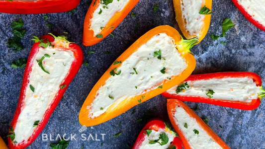 Mini Stuffed Peppers, bite-sized bell peppers filled with a savory mixture of meats, cheeses, and/or vegetables, baked to perfection, offering a delightful and flavorful appetizer or snack option.