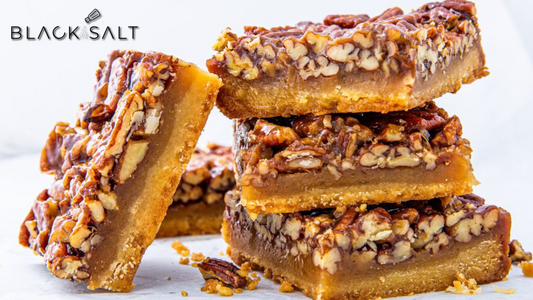 Pecan Pie Bites, bite-sized versions of the classic pecan pie, featuring a buttery crust and a sweet and nutty pecan filling, offering a delicious and indulgent dessert option for a taste of Southern comfort.