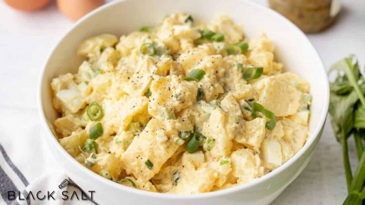 Potato Salad, a classic salad made with boiled potatoes, mixed with a creamy dressing, and combined with ingredients such as mayonnaise, mustard, onions, and various herbs and seasonings, offering a flavorful and satisfying side dish option.