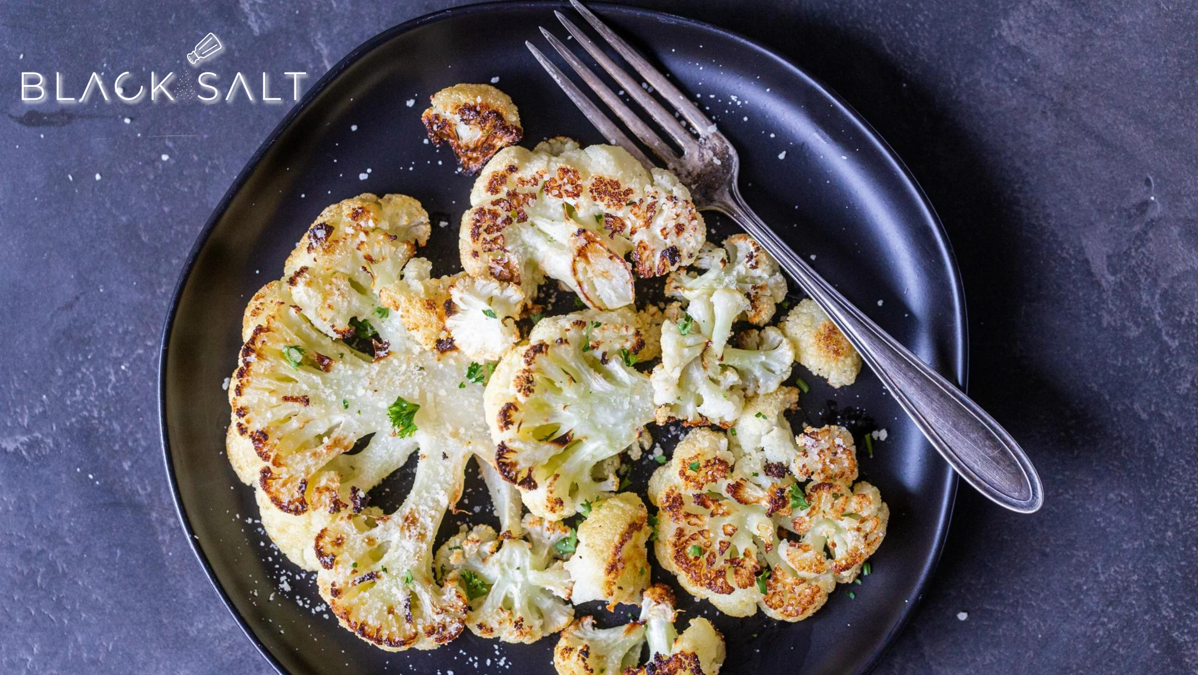 Roasted Cauliflower Steak, thick slices of cauliflower roasted to perfection, offering a delicious and satisfying vegetarian main dish option with a flavorful and hearty texture.