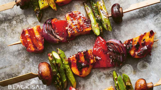 Roasted Vegetable Skewers, skewers loaded with a colorful assortment of roasted vegetables such as bell peppers, zucchini, mushrooms, and cherry tomatoes, offering a flavorful and healthy option for grilling or baking.