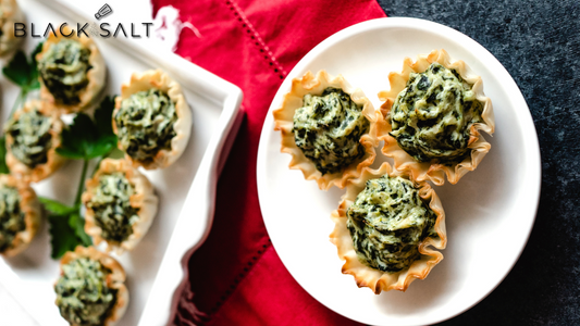 Spinach Artichoke Tarts, savory and flavorful tarts filled with a creamy spinach and artichoke mixture, baked to a golden brown, offering a delicious and elegant appetizer or snack option.