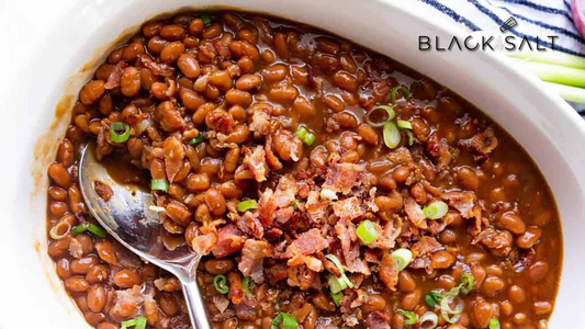 Stampede Beans, a flavorful and hearty dish made with pinto or kidney beans, simmered with seasonings, tomatoes, and often accompanied by bacon or sausage, offering a satisfying and comforting side dish commonly enjoyed in Western cuisine.