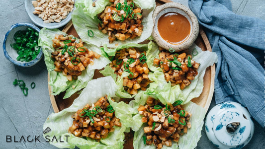 Tofu Lettuce Wraps, fresh and crisp lettuce leaves filled with seasoned tofu, vegetables, and a flavorful sauce, offering a light and healthy option for a tasty and satisfying meal or appetizer.