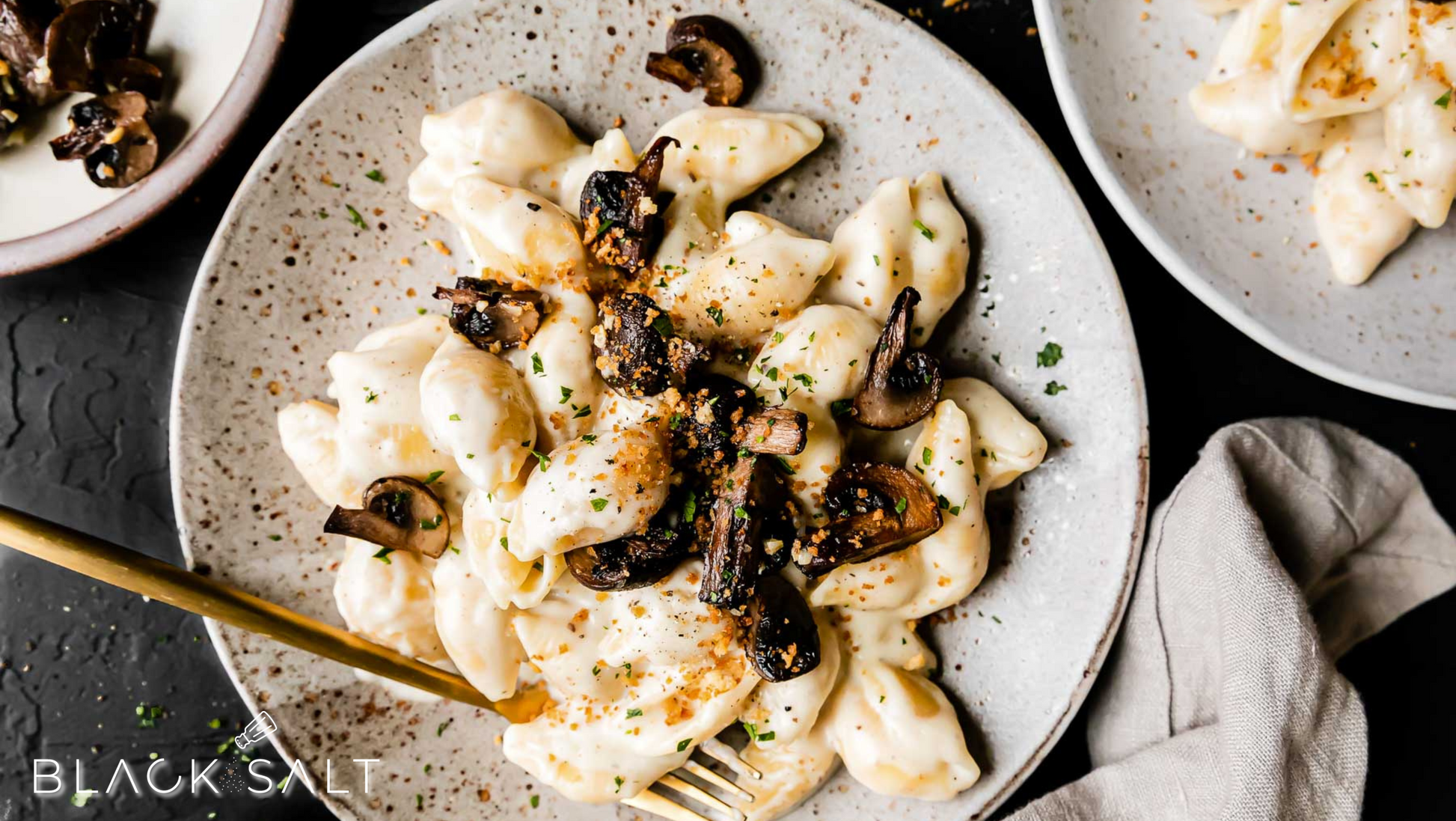 Truffle Macaroni & Cheese, a gourmet twist on the classic comfort food, featuring creamy macaroni and cheese infused with the rich and earthy flavors of truffle oil or truffle paste, offering a luxurious and indulgent dish.