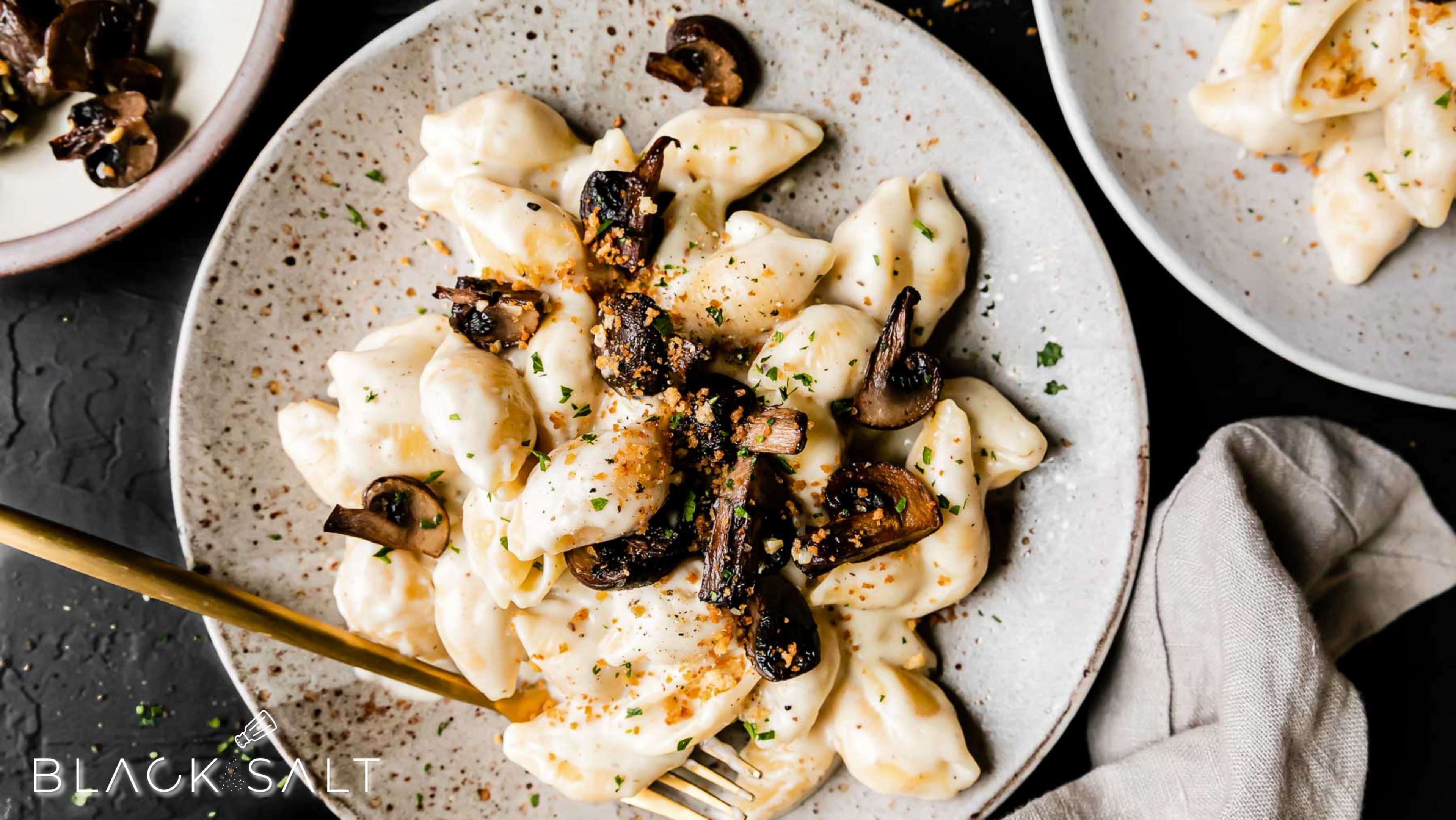 Truffle Macaroni & Cheese, a gourmet twist on the classic comfort food, featuring creamy macaroni and cheese infused with the rich and earthy flavors of truffle oil or truffle paste, offering a luxurious and indulgent dish.