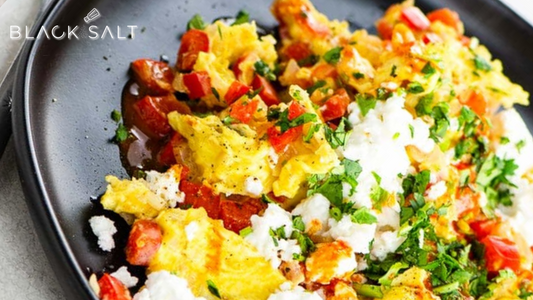Vegetable Scramble Tray, a delightful assortment of scrambled eggs mixed with a colorful medley of sautéed vegetables, such as bell peppers, onions, mushrooms, and spinach, offering a flavorful and nutritious option for breakfast or brunch.