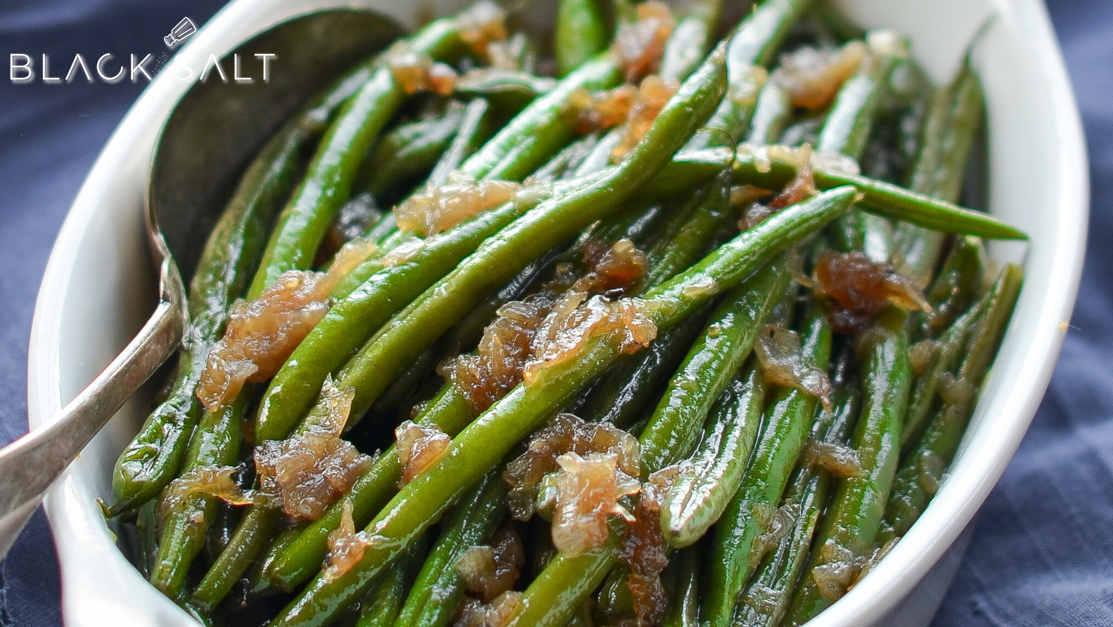 Wax Beans, bright and crisp legumes with a yellow or wax-like appearance, often steamed, boiled, or sautéed as a nutritious and vibrant side dish or ingredient in various recipes.